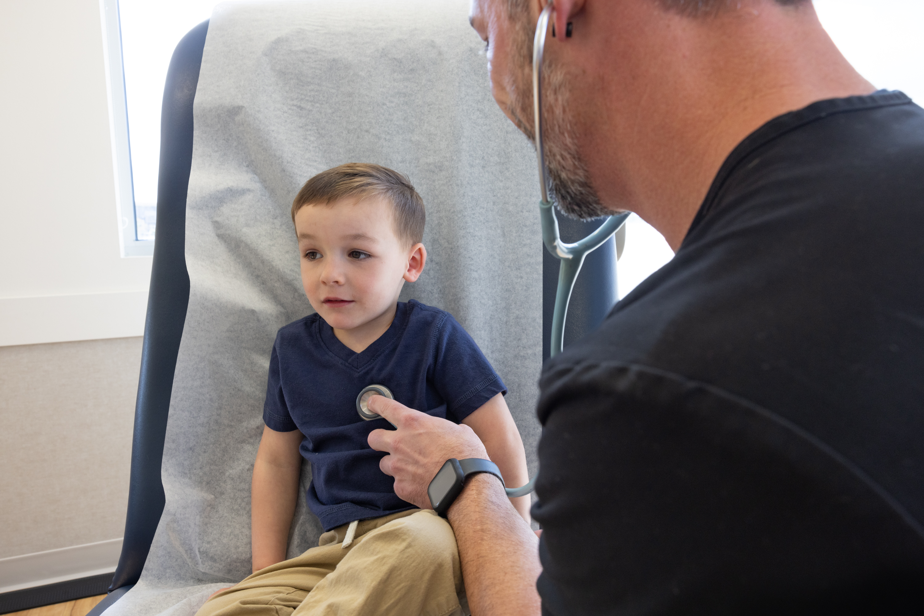 Nurse checking child 2